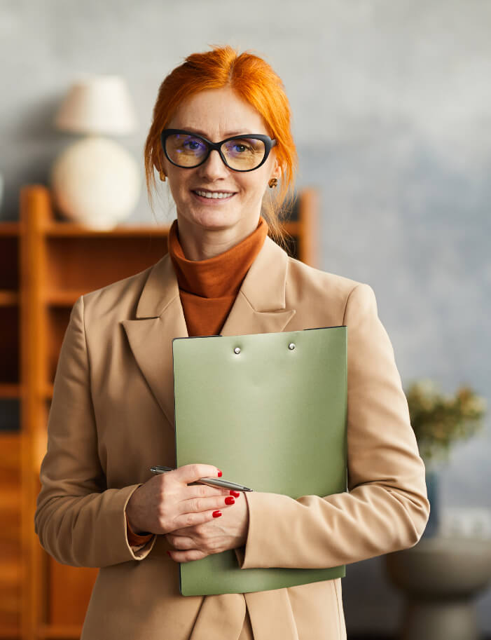 Trauma therapist in Tulsa holding a notepad